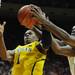 Michigan freshman Glenn Robinson III fights for a rebound against Indiana junior Victor Oladipo and freshman Jeremy Hollowell during the first half at Assembly Hall on Saturday, Feb. 2 in Bloomington, Ind. Melanie Maxwell I AnnArbor.com
